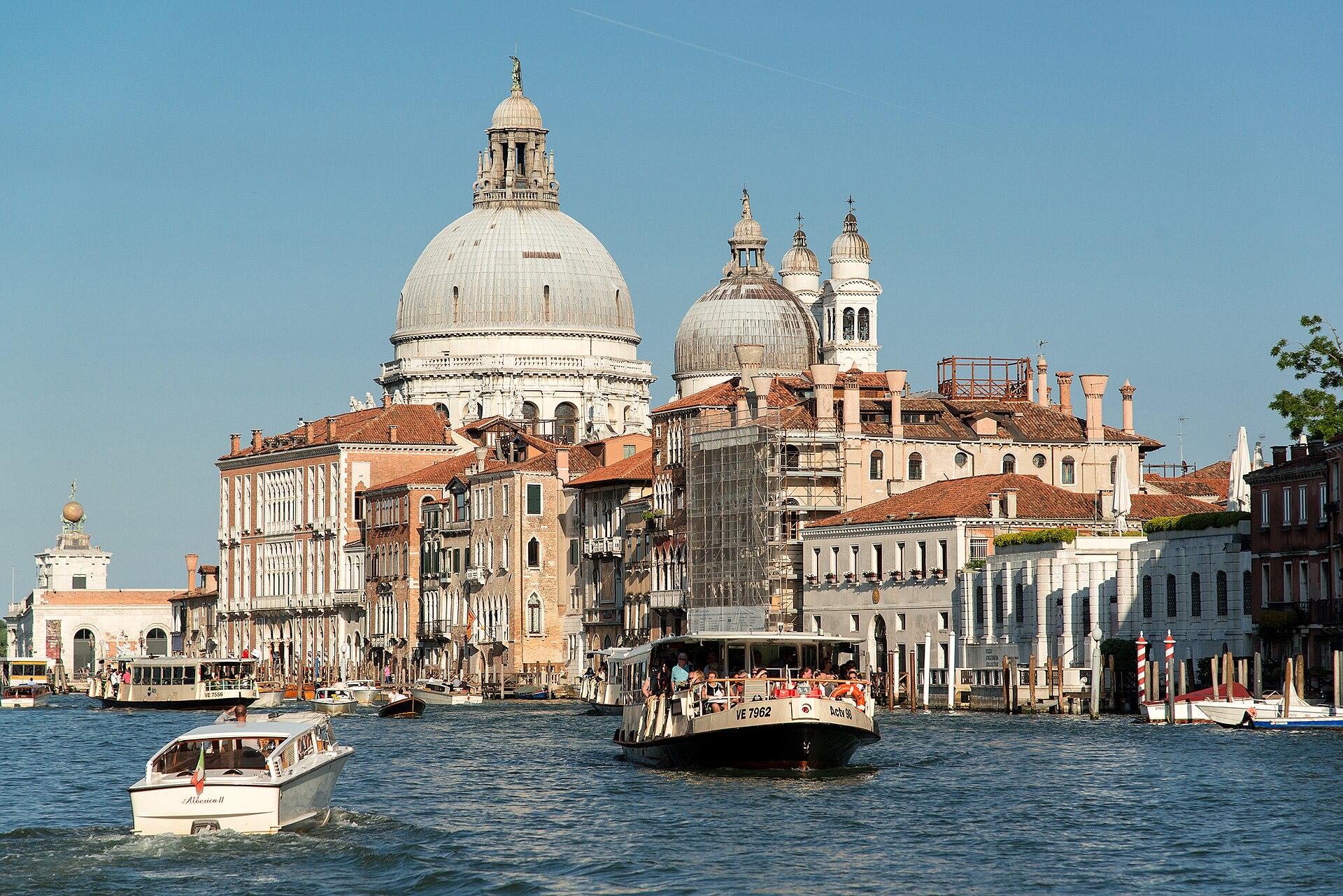A vaporetto on the Grand Canal among other boat traffic